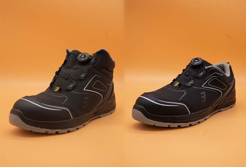 Zwei schwarze Sicherheitsschuhe mit Drehverschluss, einmal als Stiefel und einmal als Halbschuh.